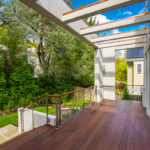 Backyard deck with dark wood accents