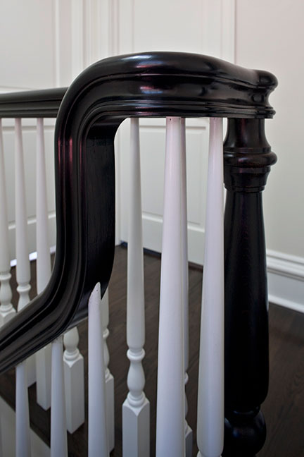 Close up of beautifully crafted black and white staircase railing