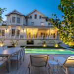 Exterior Shot of Luxury Home in Washington DC at Night, Lit-Up Pool