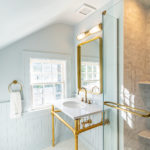 Historic Renovation On A DC Bathroom with Golden Accents