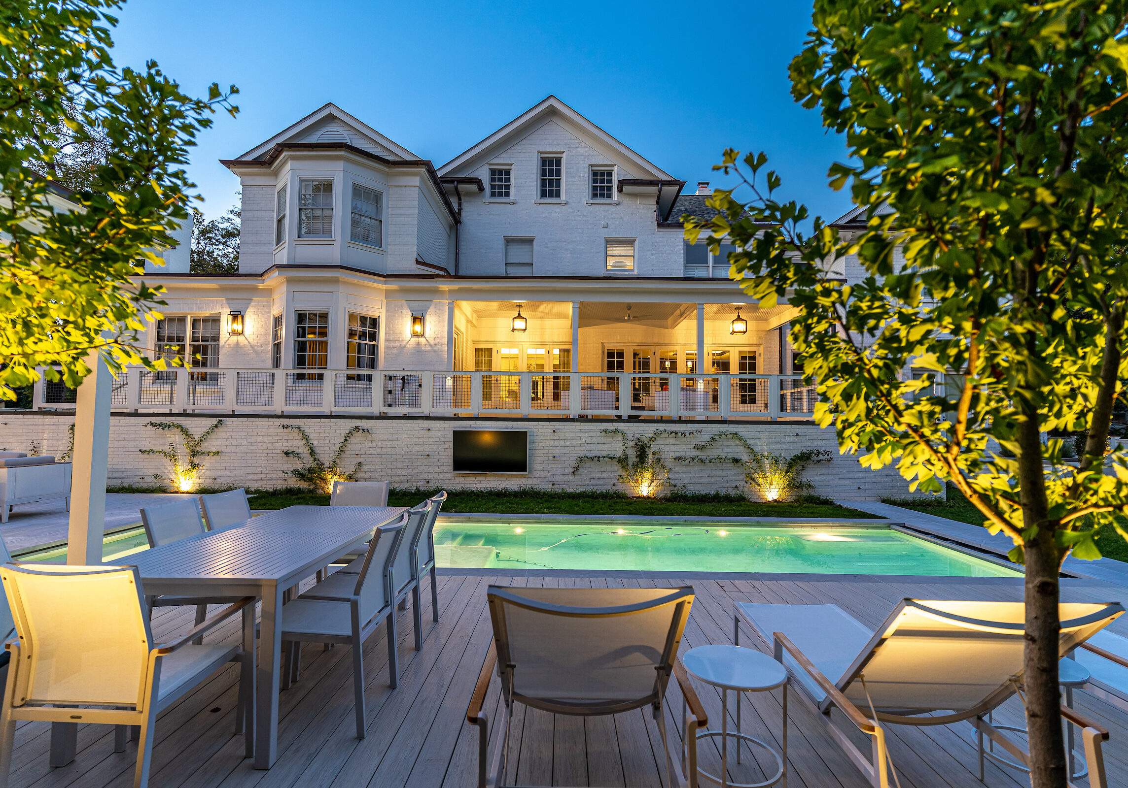 Exterior Shot of Luxury Home in Washington DC at Night, Lit-Up Pool